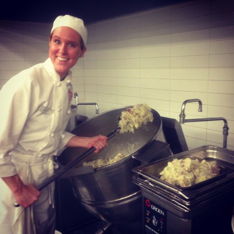 Chloe helping me shovel potatoes into pans