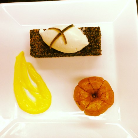 Poppyseed cake topped with a quennelle of whipped cream, a schmear of lemon curd, and a baked apple