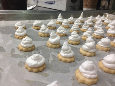 Butter cookie topped with Swiss meringue.